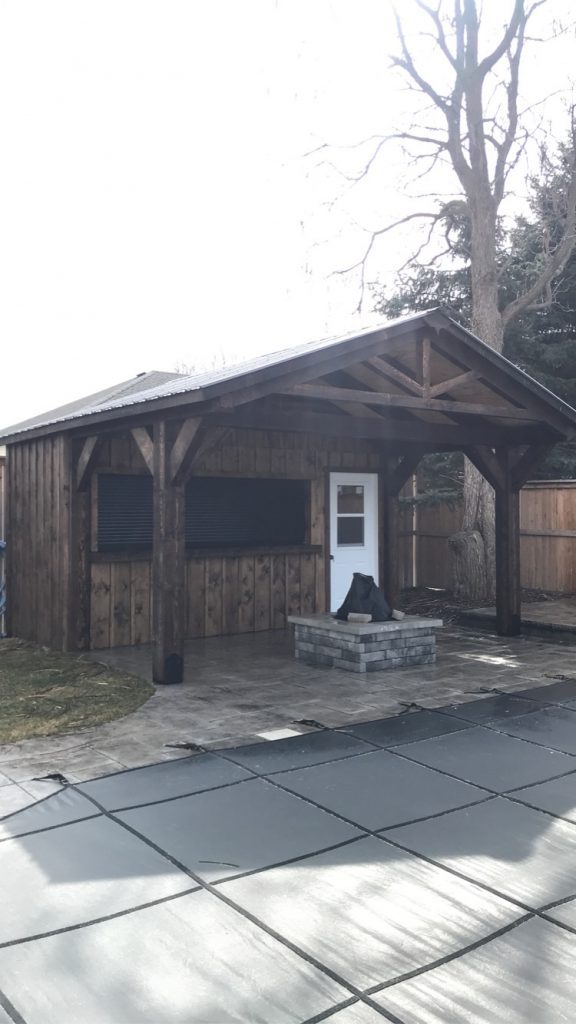 Pool bar with covered porch and firepit